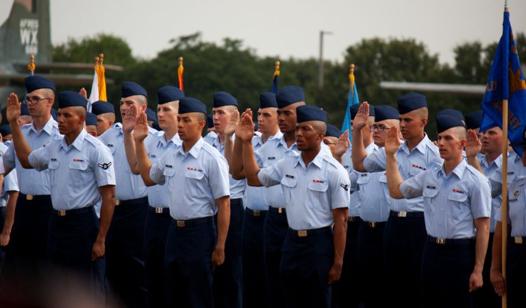 Service members pledging their military oath